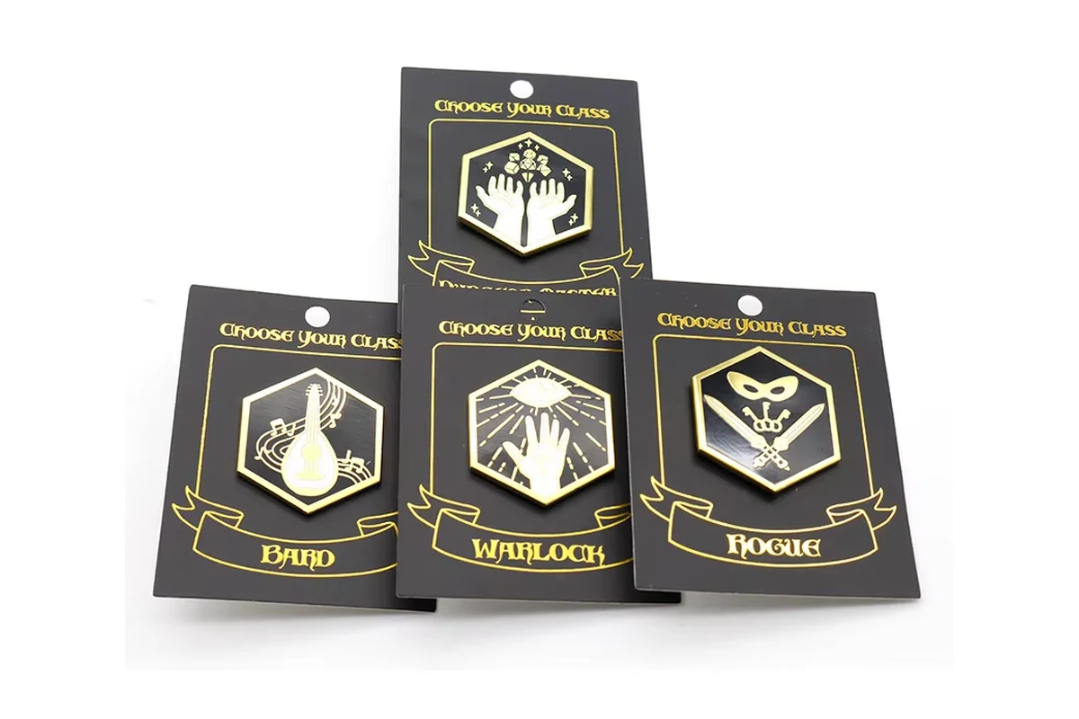 Four gold-tone hexagonal symbol pins on black printed display cards.