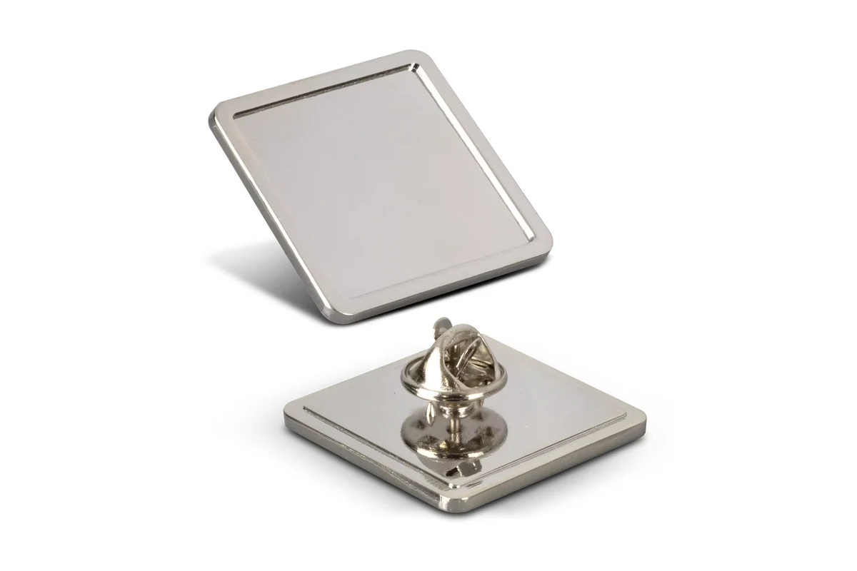 Silver square blank pin showing its framed face and butterfly-clutch back.
