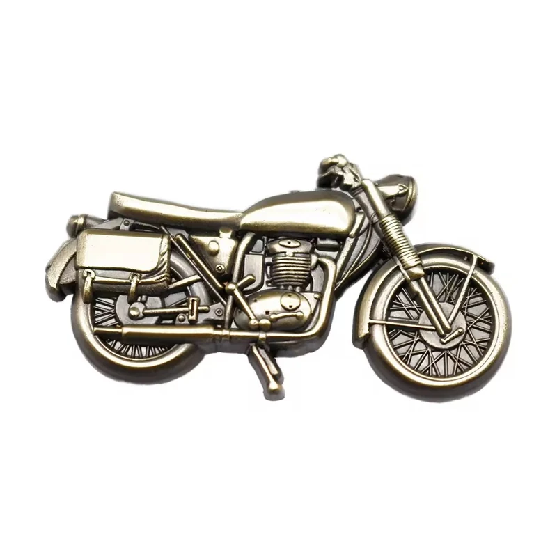 Antique silver motorcycle lapel pin isolated on white.