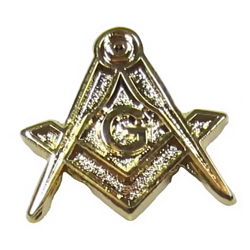 Gold compass-and-square fraternal lapel pin with textured metal details.