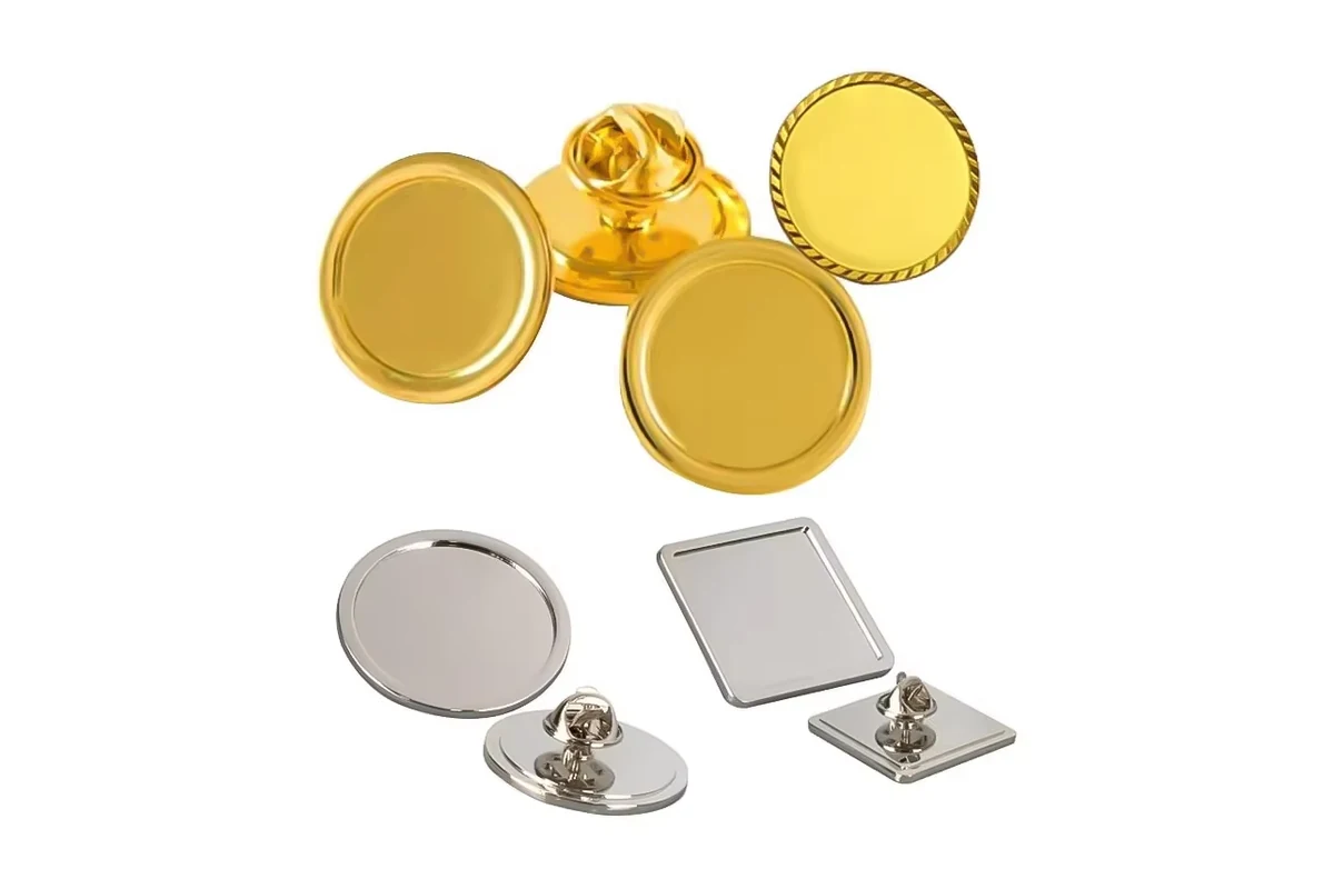 Blank gold round badges and silver round and square badges with metal butterfly clutches.