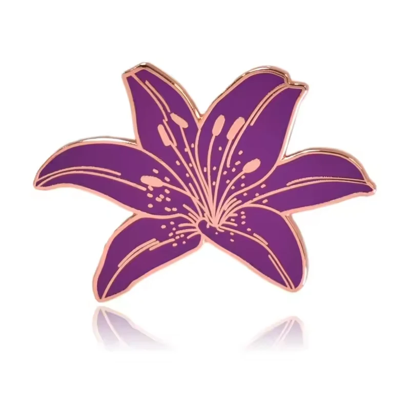 A purple lily pin with gold details.