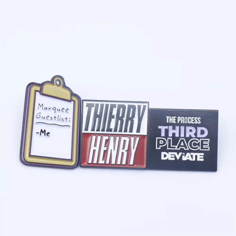 Three illustrated pins with a clipboard design, Thierry Henry lettering and a Third Place sign.