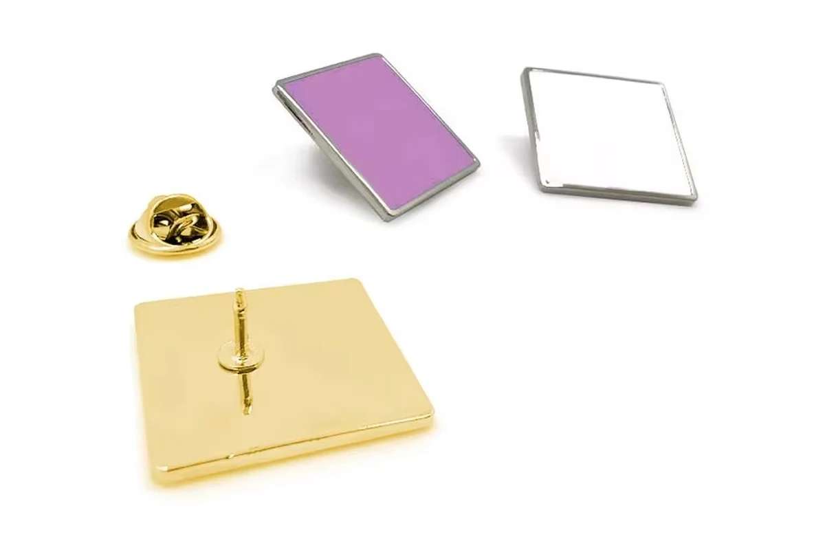 Purple rectangular pin face, separate blank silver frame, and gold reverse with a visible post.