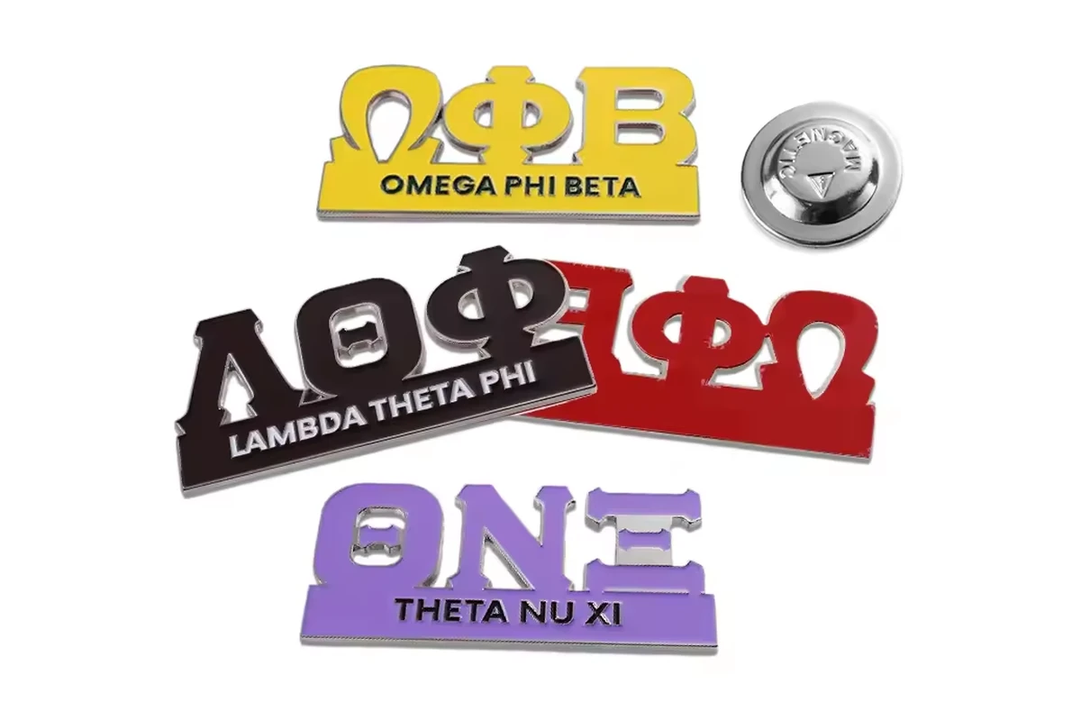 Four colored Greek-letter society pins with a silver butterfly clutch.
