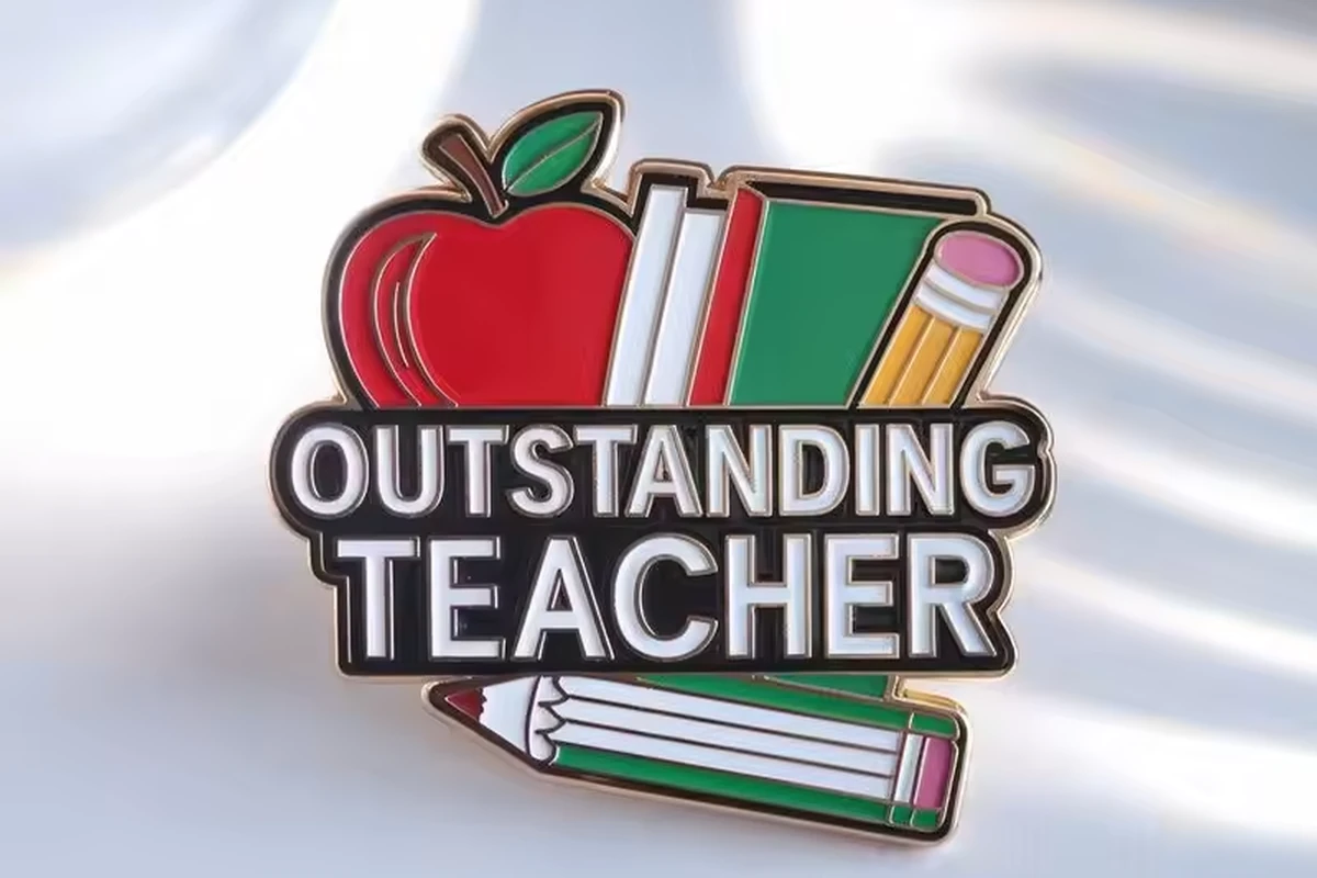 An Outstanding Teacher pin with an apple, books and pencils.
