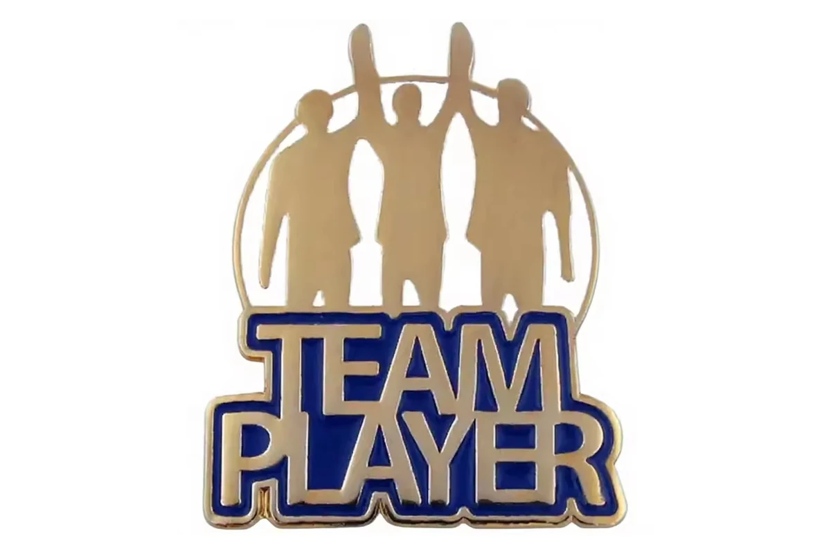 Gold and blue Team Player recognition pin with a group silhouette.