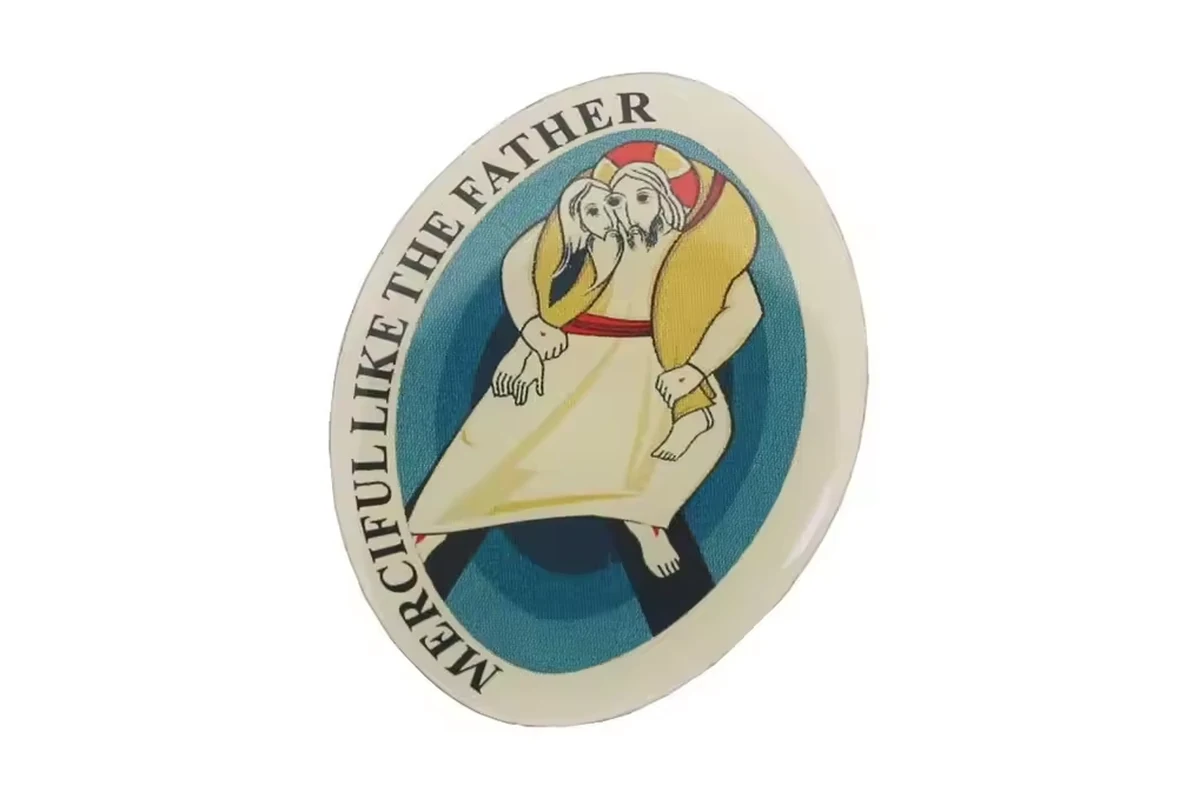 Oval illustrated club pin featuring a character in a pale cape.