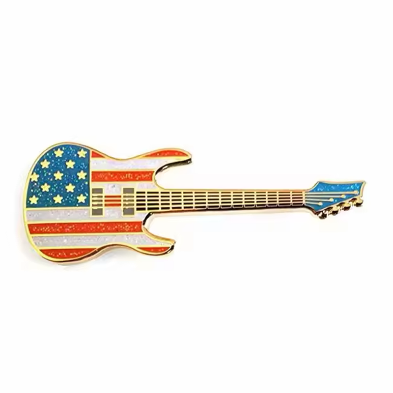 Electric guitar pin with glittery red and white stripes, a blue star field, gold-colored strings and a blue headstock.