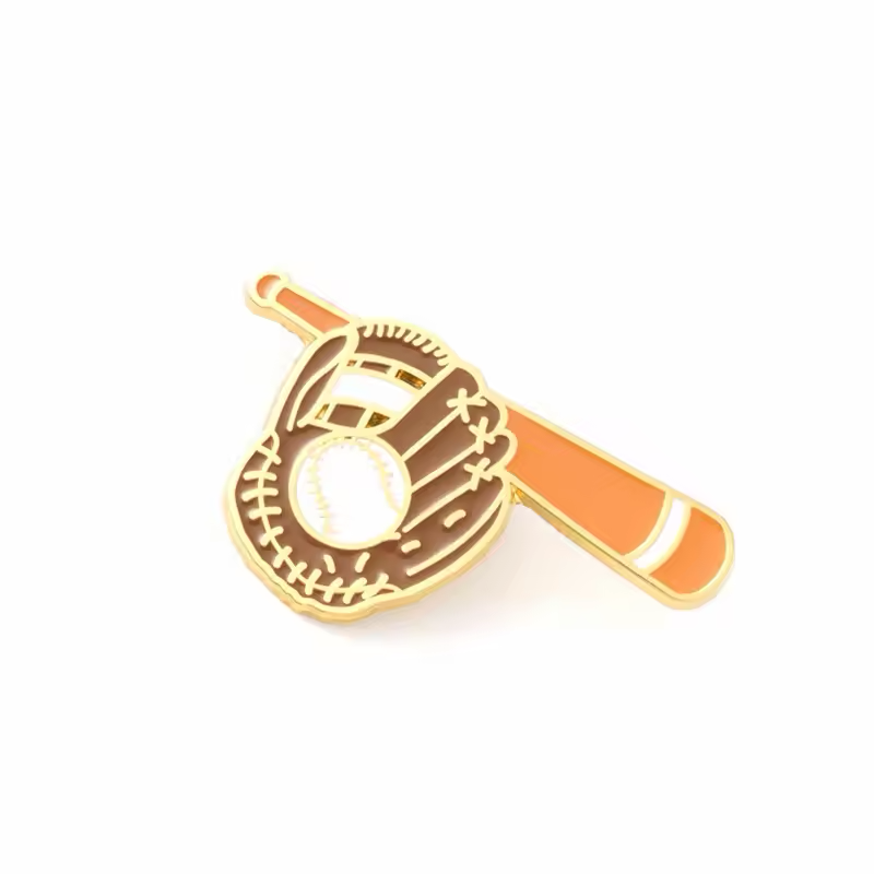 Gold-tone baseball pin with a brown glove, white baseball and orange bat set diagonally behind the glove.