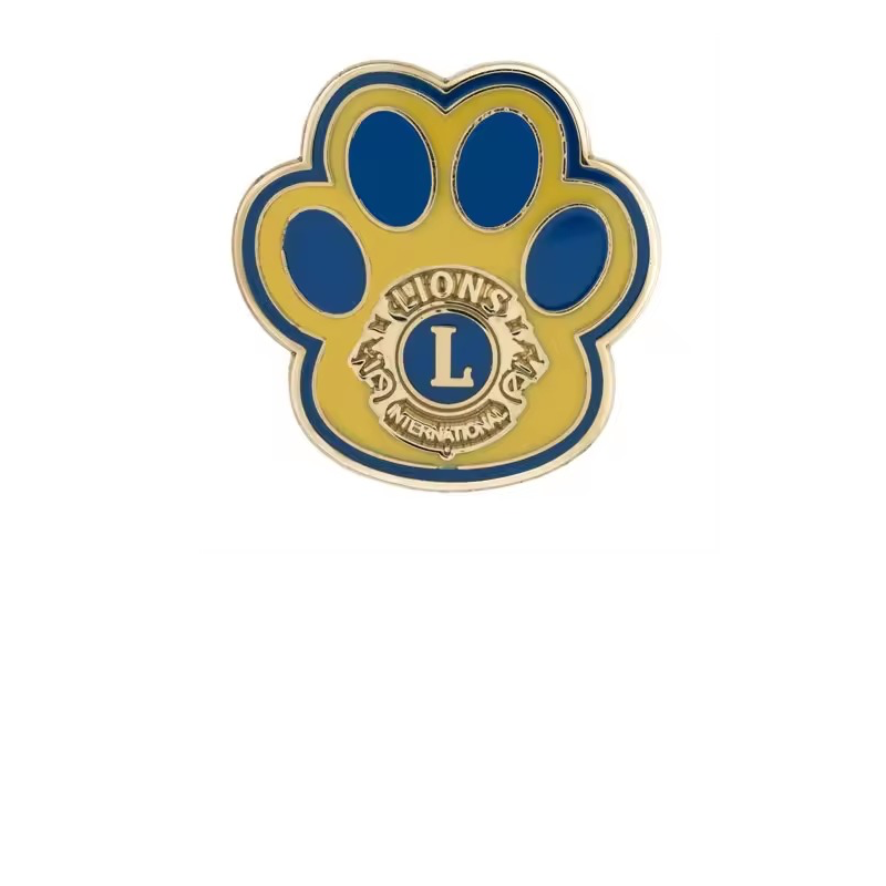 Yellow paw-shaped pin with blue toe pads and border, gold-tone outlines and a central Lions International L emblem on a white background.