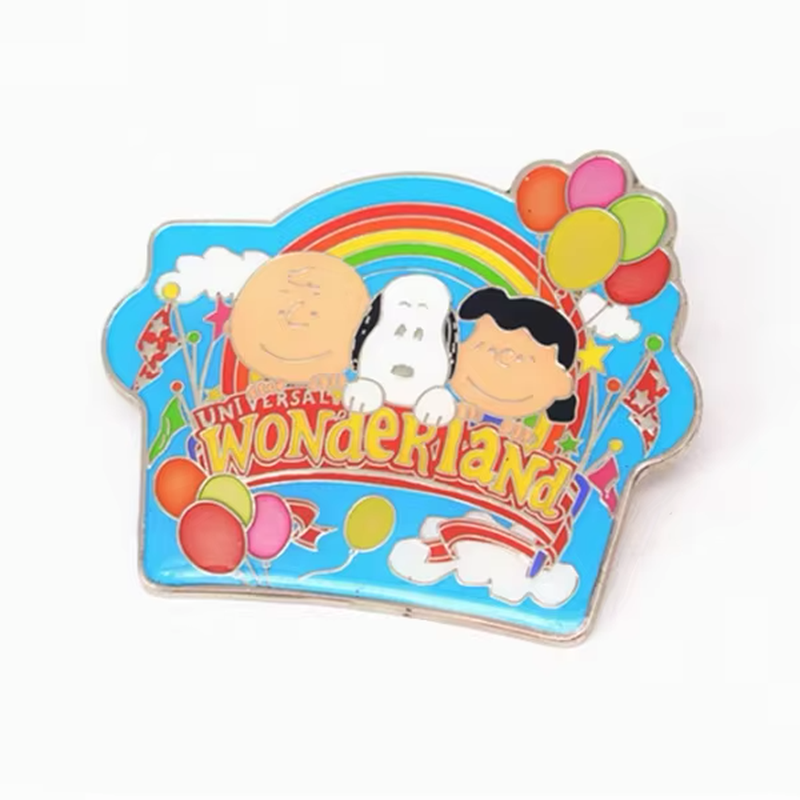 Colorful theme park pin with cartoon characters, a rainbow, balloons and Universal Wonderland lettering.