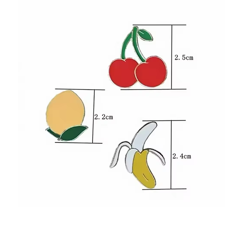 Cherry, lemon and peeled banana pins with printed size labels of 2.5 cm, 2.2 cm and 2.4 cm respectively.