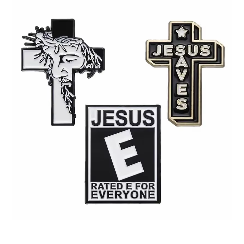 Three Christian-themed pins with a Jesus portrait cross, a lettered cross and a rectangular text design.