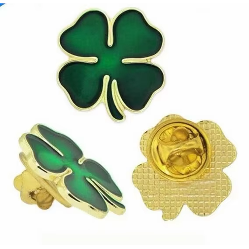 Green four-leaf clover pin shown from the front, side and back.