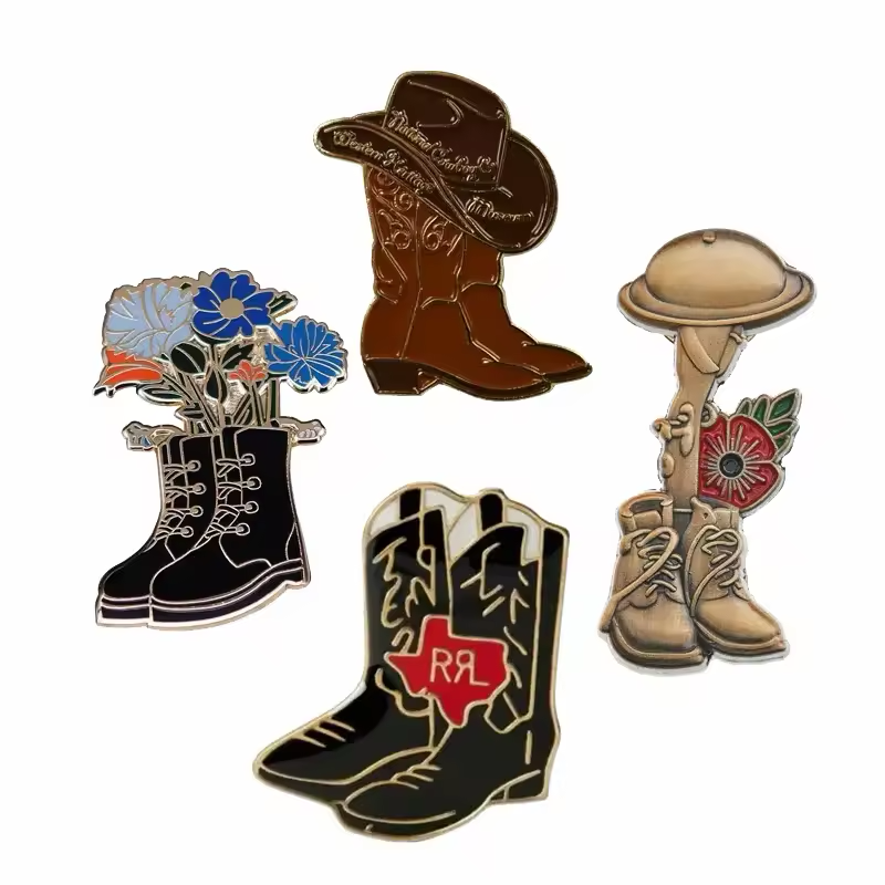 Four boot-themed pins showing brown cowboy boots with a hat, black lace-up boots with flowers, tan boots with a helmet and red poppy, and black cowboy boots with a red Texas-shaped emblem on white.