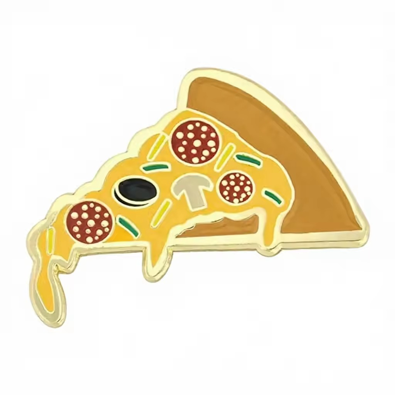 Gold-tone pizza slice pin with dripping yellow cheese, three red pepperoni rounds, green strips, a mushroom, a black olive and brown crust on a white background.