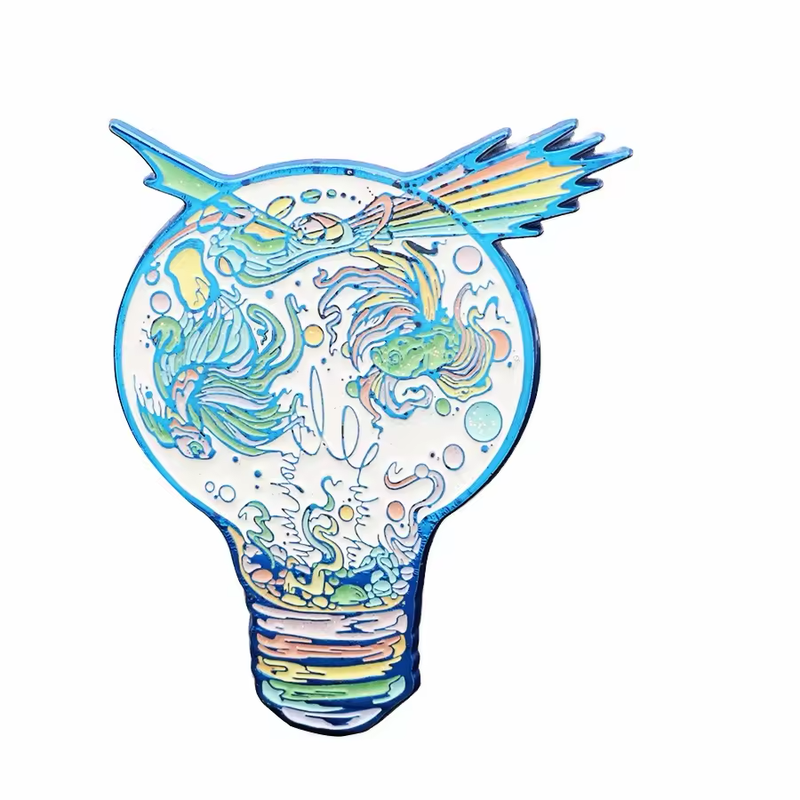 Light bulb-shaped pin with blue outlines, pastel fantasy creatures and a multicolored comet across the top.