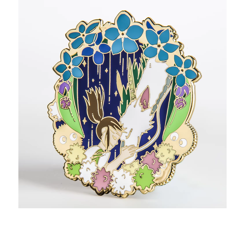 Gold-colored fantasy pin showing a girl beside a white dragon, framed by blue flowers and small colorful creatures.
