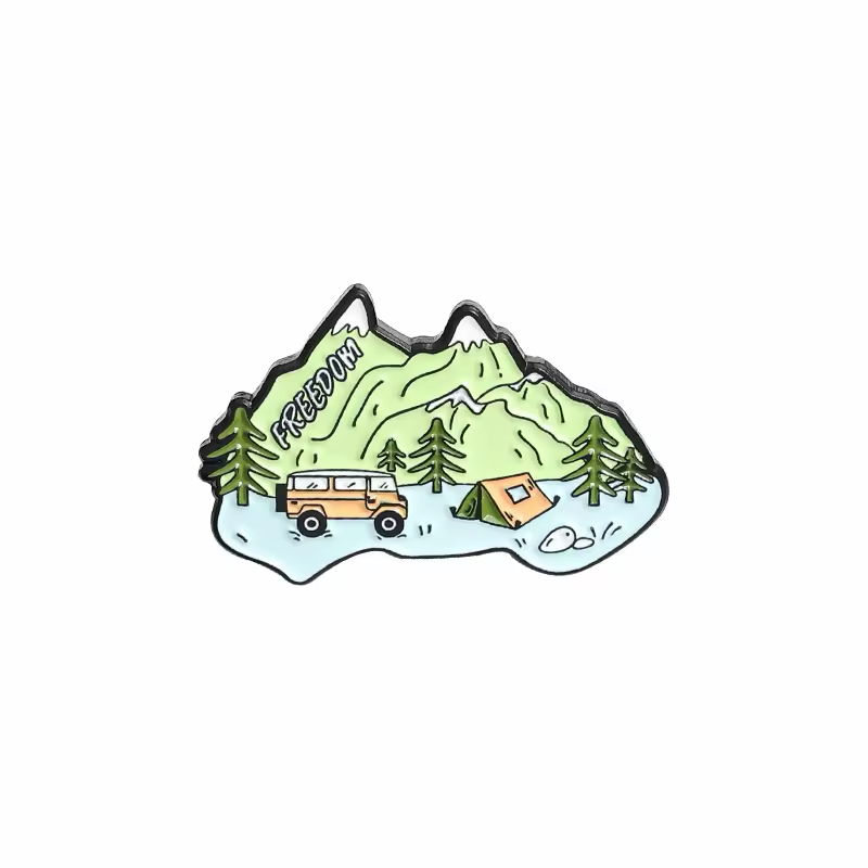 Mountain camping pin showing green peaks, pine trees, a yellow off-road vehicle, a tent and the word FREEDOM.