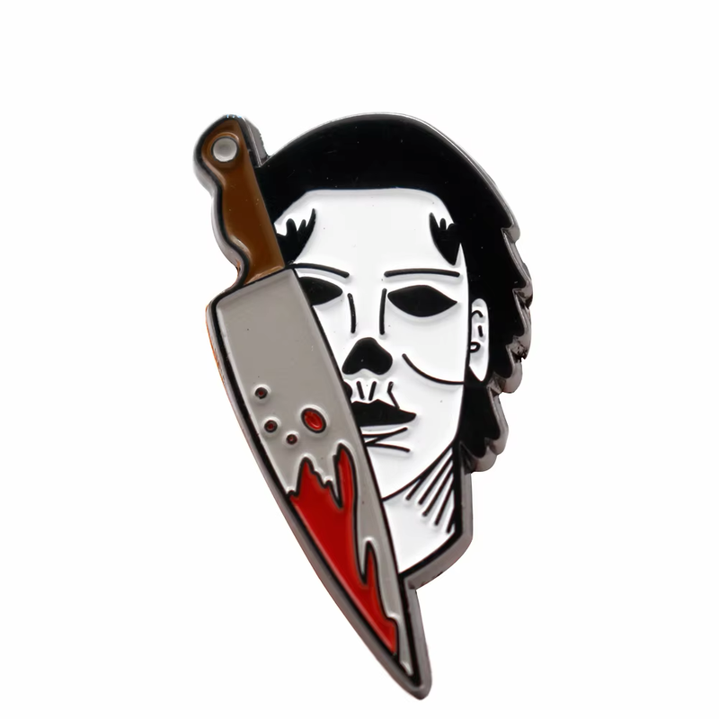 White masked character pin with black hair and a red-stained cleaver.
