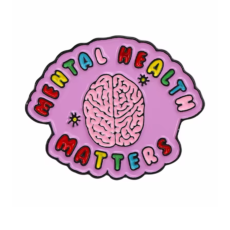 Purple scalloped pin with a pink brain and multicolored Mental Health Matters lettering.