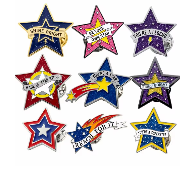 Nine multicolor star pins with glitter effects, layered stars, ribbon banners, shooting-star motifs and inspirational lettering on a white background.