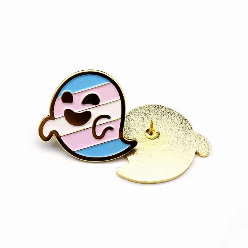 Smiling ghost pin with blue, pink and white stripes, shown beside its gold-colored textured back and pin post.