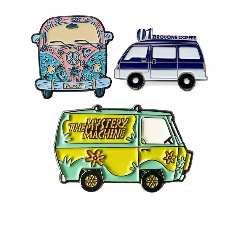 Three van pins showing a pink-and-turquoise floral Peace van, a navy-and-white coffee van with a roof sign, and a green-and-yellow van with The Mystery Machine lettering on white.