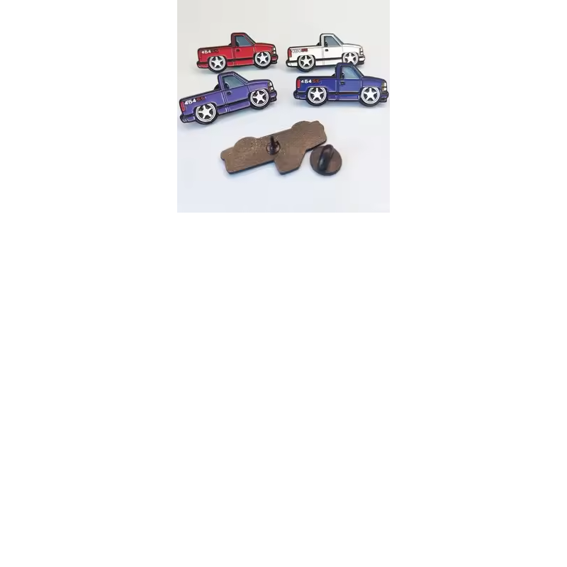 Four pickup truck pins in red, white, purple and blue, with a reverse view showing a pin post and a black rubber clutch on a pale background.