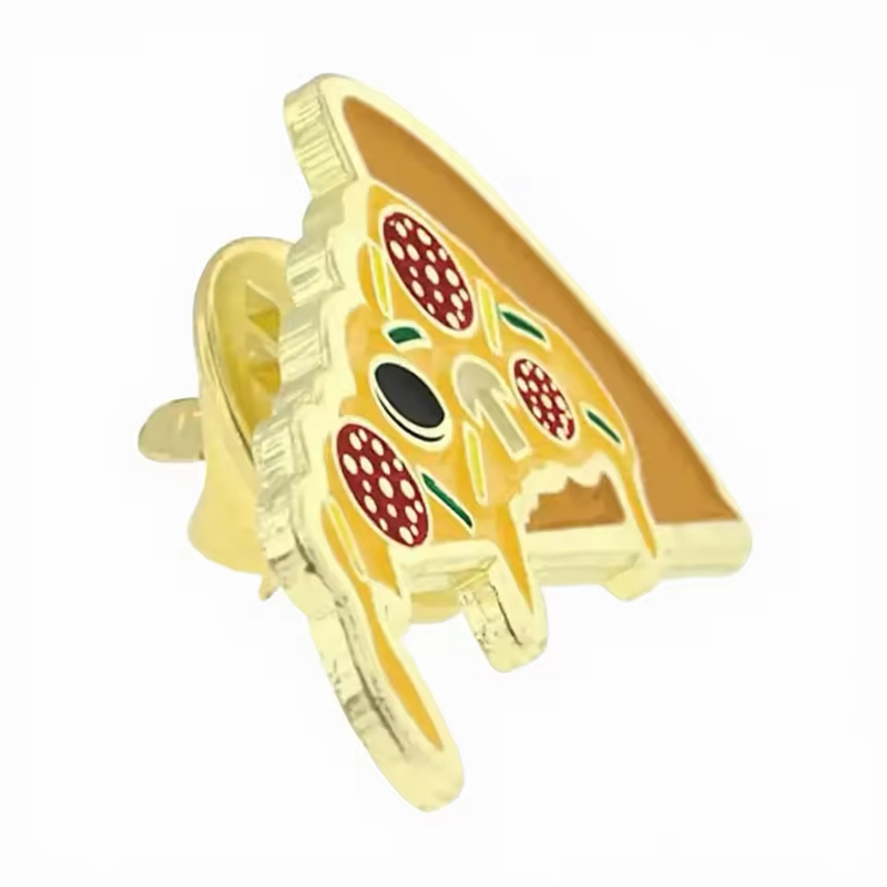 Angled view of a gold-tone pizza slice pin with yellow dripping cheese, red pepperoni, green strips, a mushroom and a black olive, showing its edge and butterfly clutch.