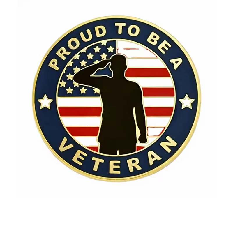Round gold-tone veteran pin with a saluting silhouette over a United States flag, a navy border and the words PROUD TO BE A VETERAN on a white background.