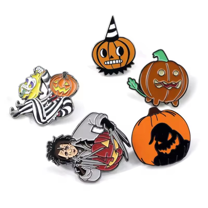 Five pumpkin and character pins with Halloween-themed designs.