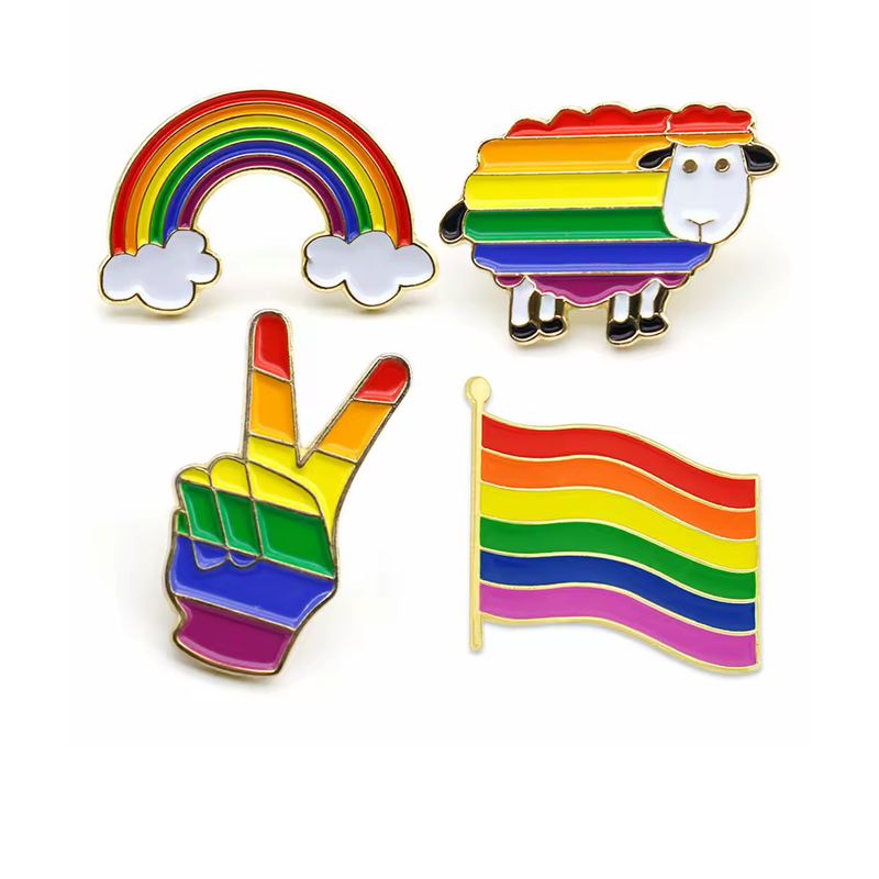 Four rainbow-striped pins shaped as a rainbow with clouds, a sheep, a peace-sign hand and a waving flag.