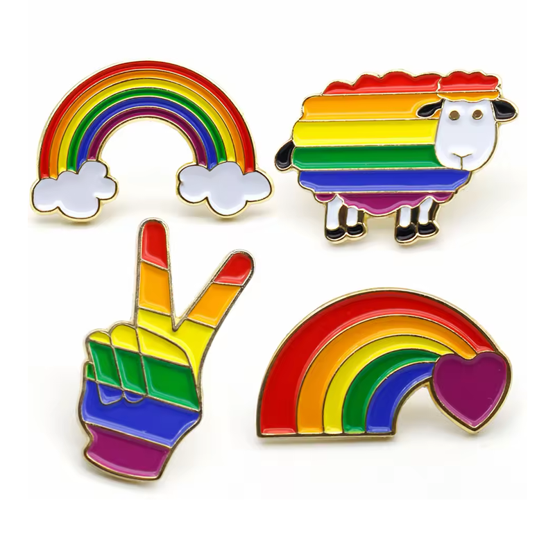 Four rainbow-striped pins in cloud rainbow, sheep, peace-sign hand and rainbow-with-heart designs.