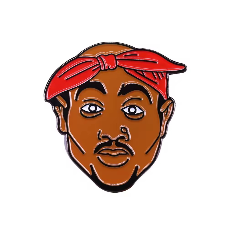Portrait pin with a brown face, a red tied bandana, black eyebrows, a mustache and a goatee on a white background.
