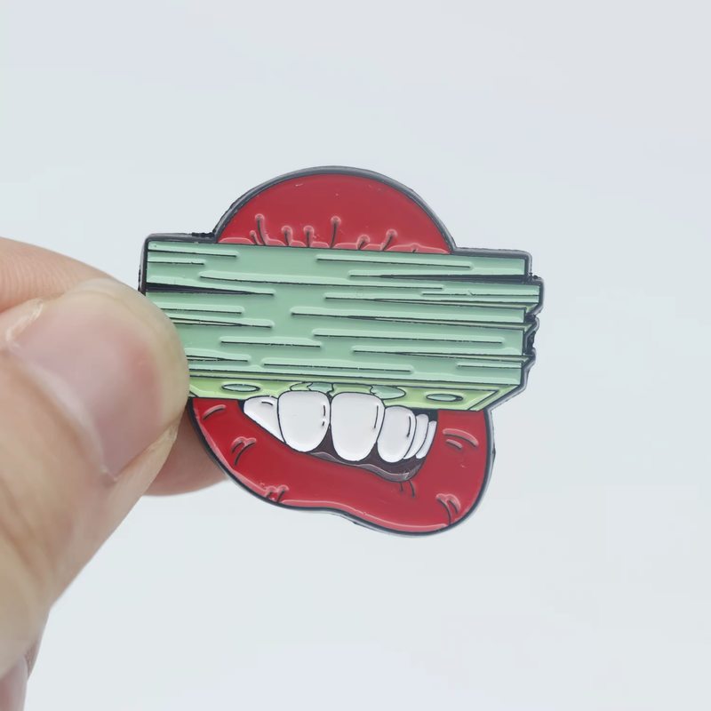 Red grinning mouth pin with large white teeth, partially covered by a stack of green banknotes and held between fingers against a pale gray background.
