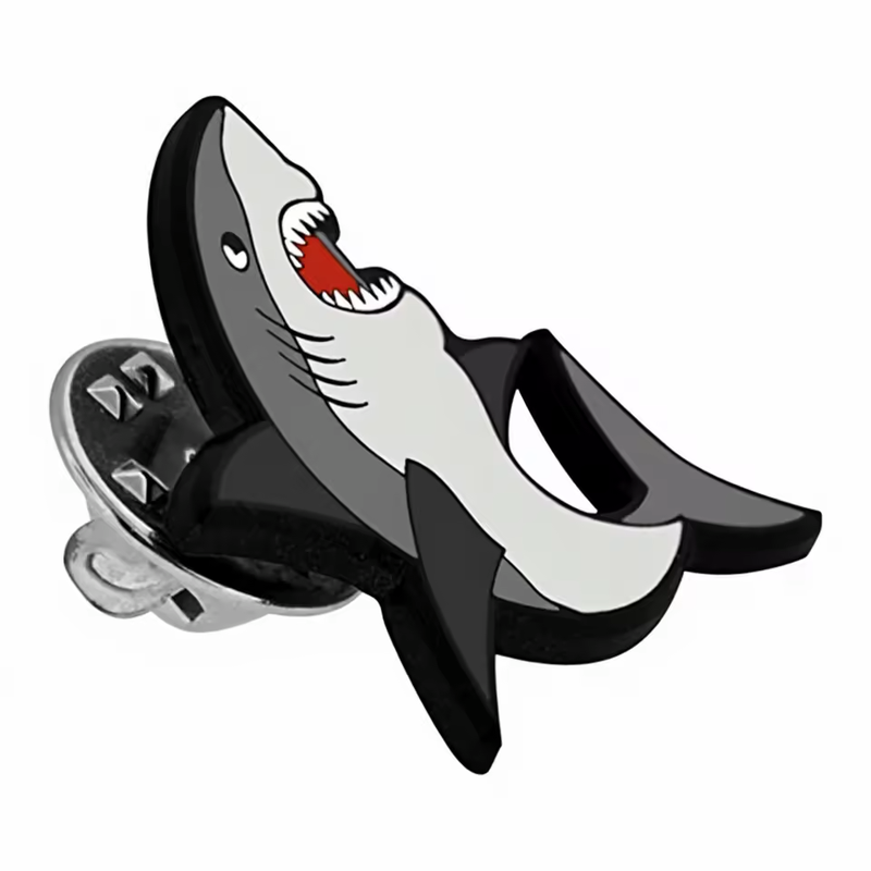 Gray, white and black shark pin with an open red mouth, white teeth and a visible silver-tone butterfly clutch on a white background.