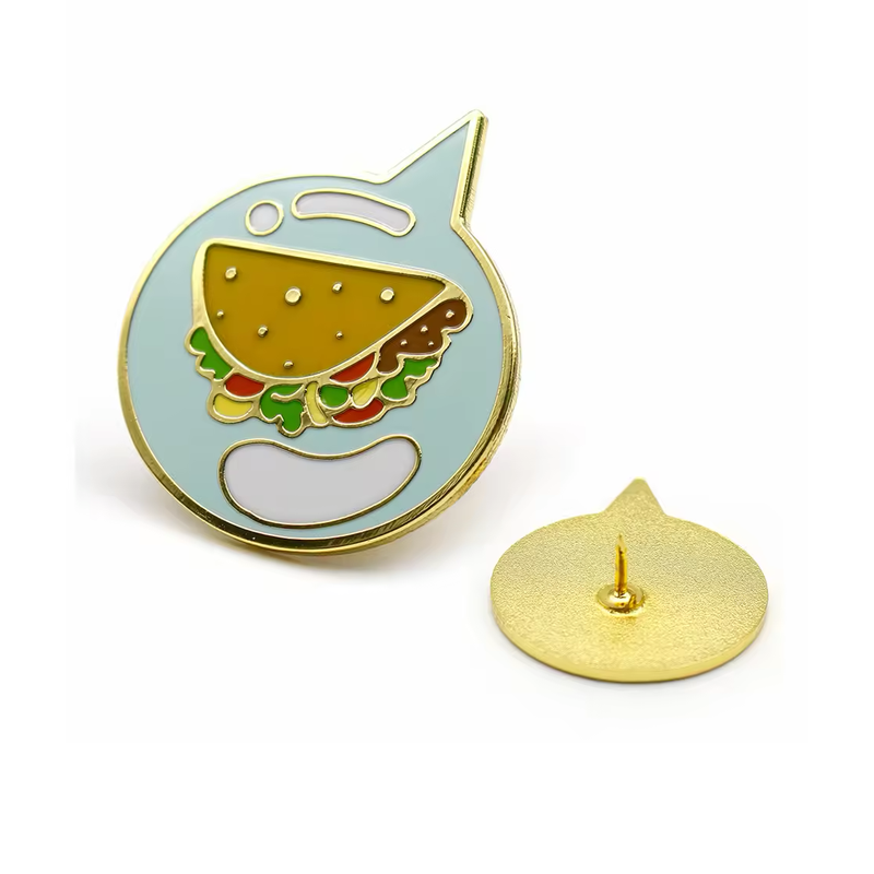 Gold-tone taco pin inside a pale blue speech bubble, shown beside the textured gold-tone back with a pin post.