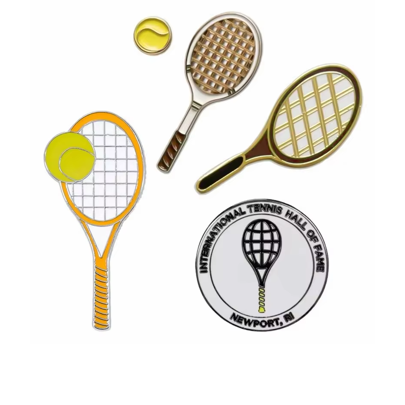Three tennis racket pins, a yellow tennis ball pin and a round tennis emblem pin on a white background.