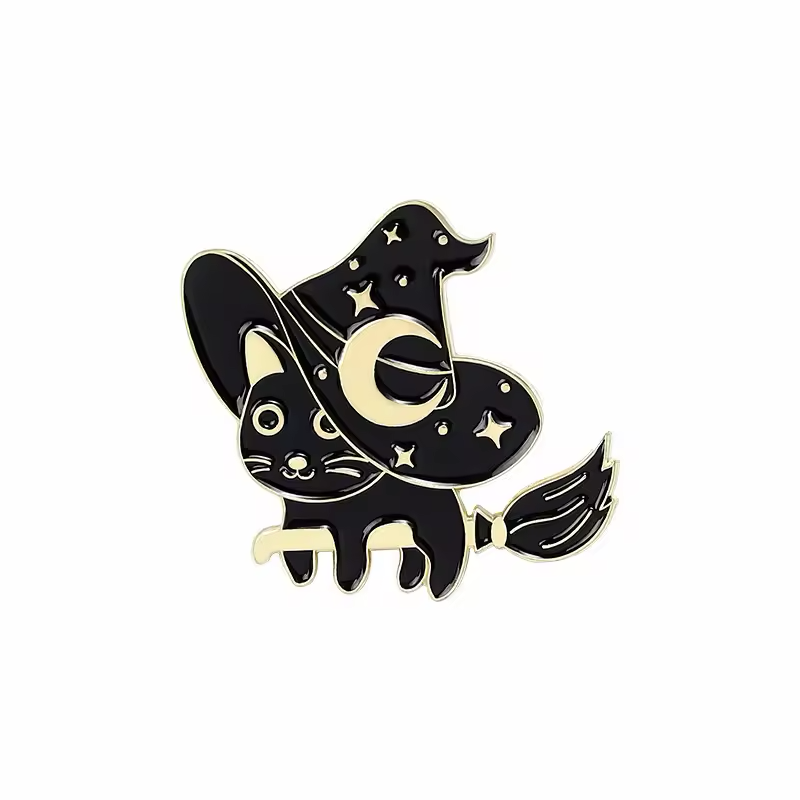 Black cat pin with a crescent-and-star witch hat and a broom.