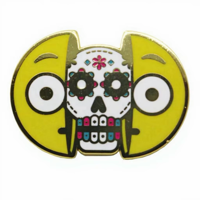 Decorative white skull pin framed by two yellow cartoon face panels, with pink flowers and multicolored teeth.