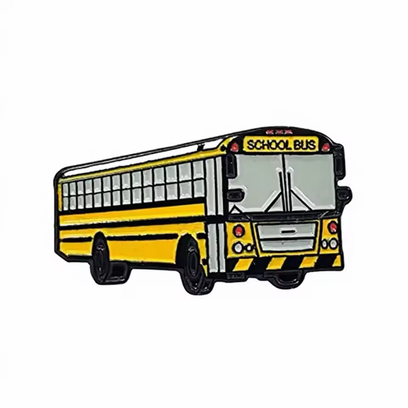 Yellow school bus pin with black outlines and stripes, gray windows and front grille, black wheels and School Bus lettering on a white background.