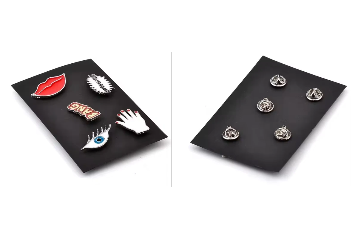 Five colorful shaped pins on the front of a black display card, beside the reverse showing five metal butterfly clutches.